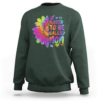 Forest green sweatshirt with colorful tie-dye sunflower graphic and bold MOM lettering