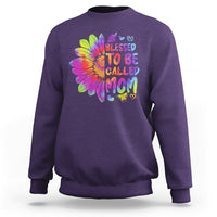 Purple sweatshirt with colorful tie-dye sunflower graphic and bold MOM lettering