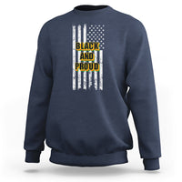 Slate blue crewneck sweatshirt with American flag stripes and “BLACK AND PROUD” front graphic