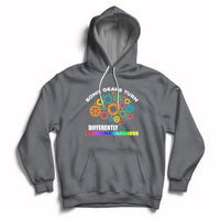 Charcoal autism awareness hoodie with colorful gear graphic, front pocket, drawstring
