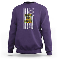 Purple crewneck sweatshirt with American flag stripes and “BLACK AND PROUD” front graphic