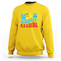 Yellow reading sweatshirt with 'WILD ABOUT READING' front graphic