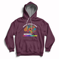 Maroon autism awareness hoodie with colorful gear graphic, front pocket, drawstring