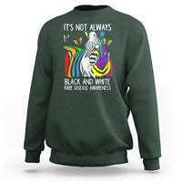 Kids forest green crewneck sweatshirt with zebra and rainbow awareness graphic on front.