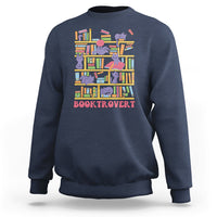 Navy crewneck sweatshirt with colorful cat-and-bookshelf graphic and text