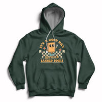 Forest green hoodie with front kangaroo pocket and “Banned Books” reading-themed graphic.