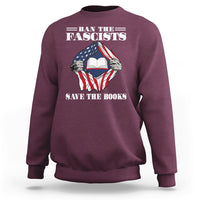 Maroon crewneck sweatshirt with patriotic fist holding open book graphic