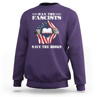 Purple crewneck sweatshirt with patriotic fist holding open book graphic