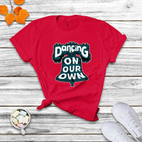 Red crew-neck T-shirt with colorful "Dancing On Our Own" graphic front.