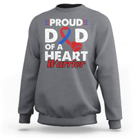Adult light heather gray sweatshirt with “PROUD D D OF A HEART Warrior” graphic and ribbon heart