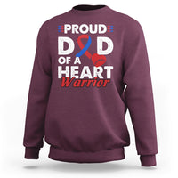 Adult maroon sweatshirt with “PROUD D D OF A HEART Warrior” graphic and ribbon heart