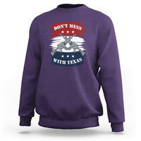 Texas graphic crewneck sweatshirt, purple, with crossed-guns emblem on chest