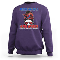 Purple crewneck sweatshirt with front warrior heart graphic and message print