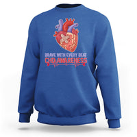 Royal blue sweatshirt with red-and-blue heart graphic and CHD awareness text print
