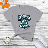 Light gray crew-neck T-shirt with colorful "Dancing On Our Own" graphic front.
