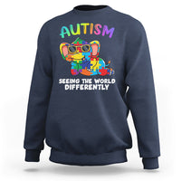 Navy crewneck sweatshirt with colorful autism graphic and 'Seeing the world differently' print