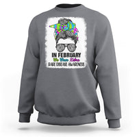 Charcoal crewneck sweatshirt with zebra messy-bun graphic and 'Rare Disease Awareness'