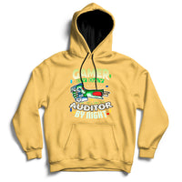 Yellow hoodie with front kangaroo pocket and “GAMER / AUDITOR BY NIGHT” graphic.
