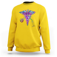 Daisy yellow crewneck sweatshirt with colorful stethoscope and wings graphic.