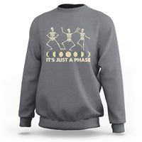 Charcoal gray crewneck sweatshirt with dancing skeleton graphic and “IT’S JUST A PHASE” text