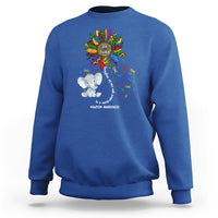 Royal blue sweatshirt with Be Kind rainbow elephant puzzle awareness graphic