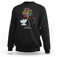Black sweatshirt with Be Kind rainbow elephant puzzle awareness graphic