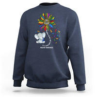 Navy sweatshirt with Be Kind rainbow elephant puzzle awareness graphic