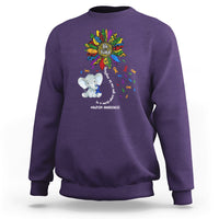 Purple sweatshirt with Be Kind rainbow elephant puzzle awareness graphic