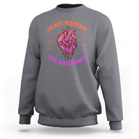 Charcoal crewneck sweatshirt with back heart graphic and CHD Awareness text