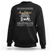 Black crewneck sweatshirt with back graphic print and compass-style design.