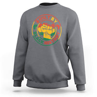 Light gray adult sweatshirt with crew neck and circular fist graphic