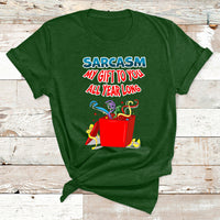 Forest green Christmas T-shirt with colorful 'Sarcasm my gift to you all year long' graphic
