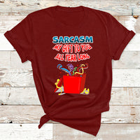 Maroon Christmas T-shirt with colorful 'Sarcasm my gift to you all year long' graphic