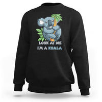 Black crewneck sweatshirt with koala graphic and 'LOOK AT ME I'M A KOALA' text