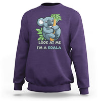 Purple crewneck sweatshirt with koala graphic and 'LOOK AT ME I'M A KOALA' text