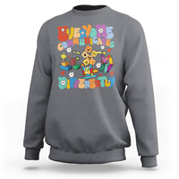 Charcoal gray crewneck sweatshirt with colorful “Be Different” graphic on chest