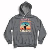 Charcoal gray maternity pullover hoodie with kangaroo pocket and drawstring hood; busy human graphic