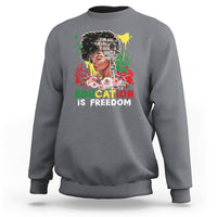 Adult crewneck sweatshirt, light gray, front graphic with face and text “Education is Freedom”.