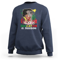 Adult crewneck sweatshirt, navy blue, front graphic with face and text “Education is Freedom”.