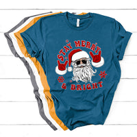 Christmas graphic T-shirt, teal blue, Santa face with “Stay Merry & Bright” text