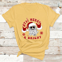 Christmas graphic T-shirt, yellow, Santa face with “Stay Merry & Bright”