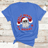 Christmas graphic T-shirt, bright blue, Santa face with “Stay Merry & Bright”