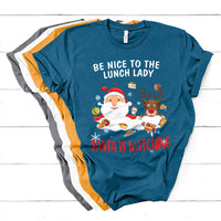 Blue Christmas T-shirt with Santa and reindeer; text reads “Be Nice to the Lunch Lady”