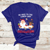 Navy Christmas T-shirt with Santa and reindeer; text reads “Be Nice to the Lunch Lady”