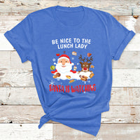 Light blue Christmas T-shirt with Santa and reindeer; text reads “Be Nice to the Lunch Lady”