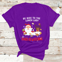 Purple Christmas T-shirt with Santa and reindeer; text reads “Be Nice to the Lunch Lady”