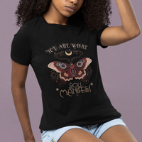 Women’s black graphic t-shirt with colorful moth and text design on front.