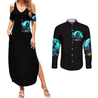 Black maxi dress with teal witch skull graphic, slit hem; long-sleeve button shirt front