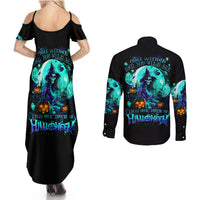 Black maxi dress and long-sleeve button shirt with teal witch skull graphic, back view