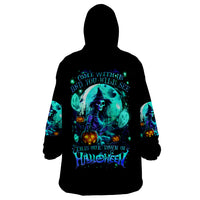 Black wearable blanket hoodie with large teal witch skull graphic on back